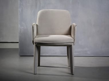 MINNE - Upholstered fabric chair with armrests by Piet Boon